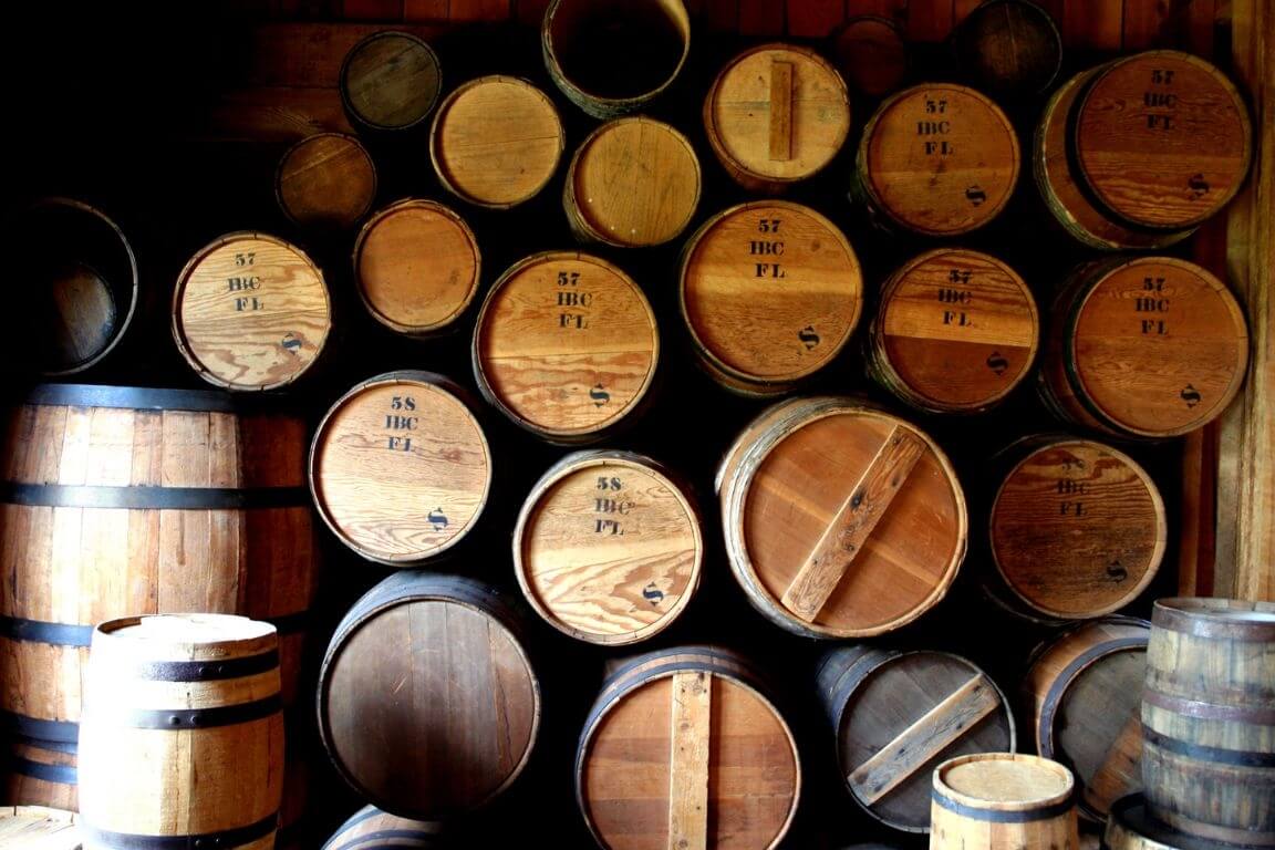 Wine barrels, stacked in a cellar.